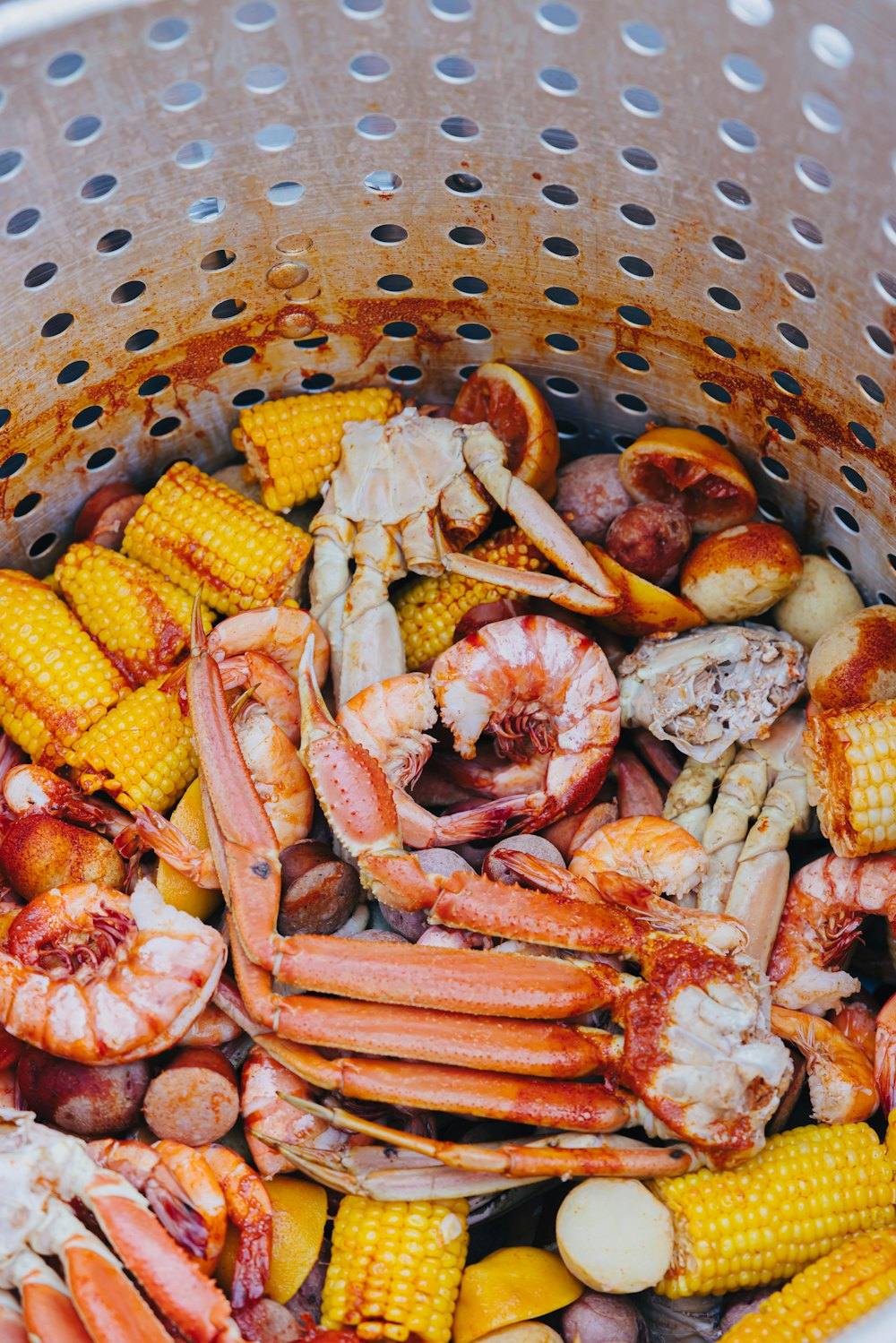 Stock photo of a seafood boil with crab legs, shrimp, corn and potatoes